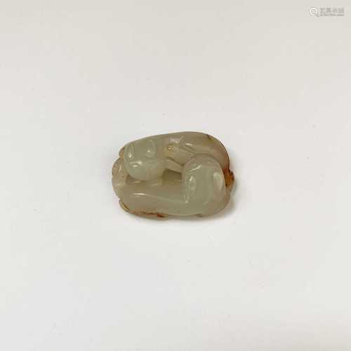 A Chinese jade carving of double felines, Qing dynasty, 4cm x 2.7cm.Condition report: UK postage: £