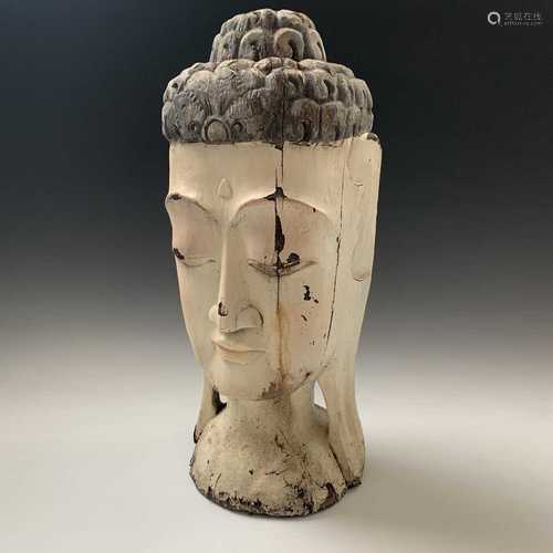 A large Chinese painted carved wood head of a female buddha, height 57cm.