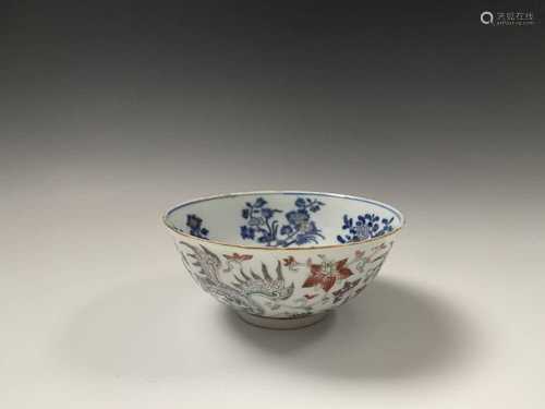 A Chinese porcelain bowl, Daoguang mark and period, 1821-1850, the ivory exterior with enamel