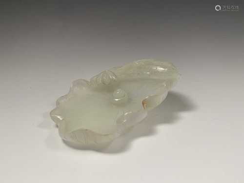 A Chinese white jade 'lotus leaf' brushwasher, 19th Century, height 2.5cm, width 13cm, depth 8.5cm.