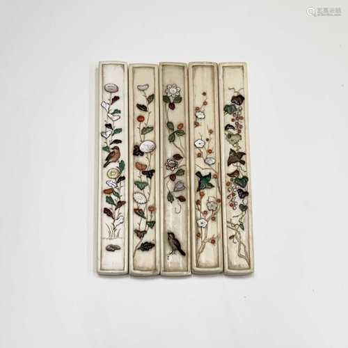 Five Japanese shibayama cutlery handles, 19th century, each inlaid with flowering plants, birds