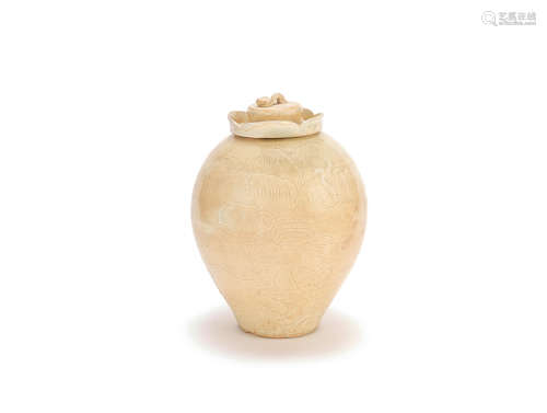 A carved cream-glazed jar and cover Song Dynasty