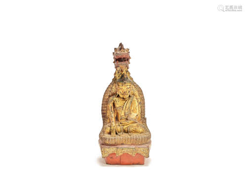 A paste-embellished gilt and lacquer wood figure of Buddha Muchalinda Burma, late 19th century