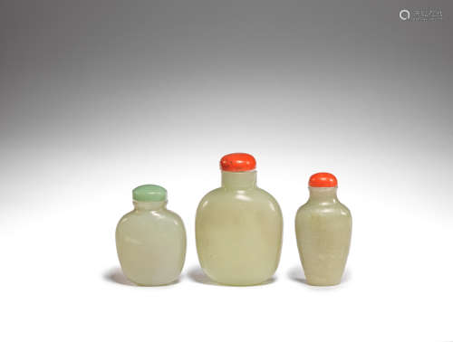 Two pale green jade snuff bottles and one glass snuff bottle 19th century and later