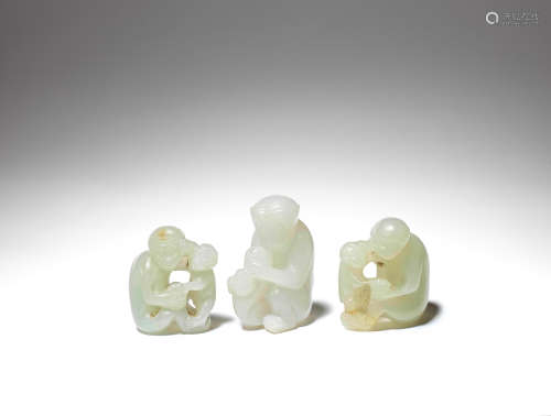A group of three pale jade 'monkey' carvings 19th/20th century