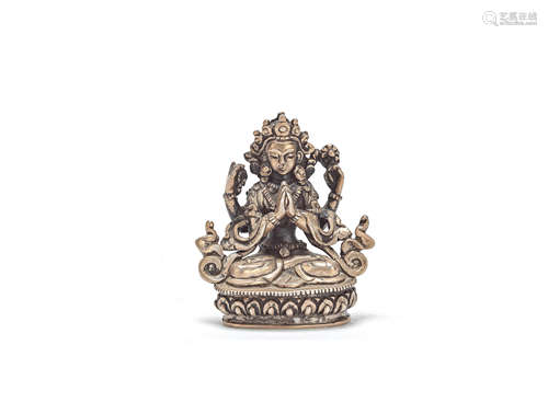 A white metal model of a four-armed buddhist deity 20th century