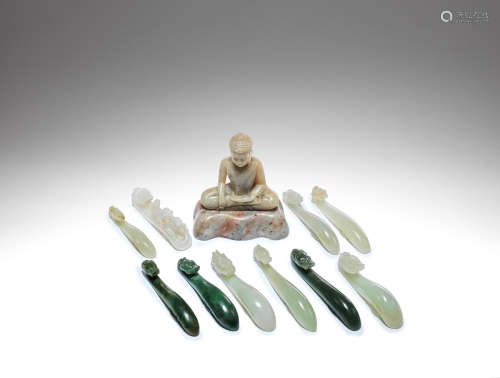 A small collection of jade belt hooks and a jade figure of Buddha Qing Dynasty