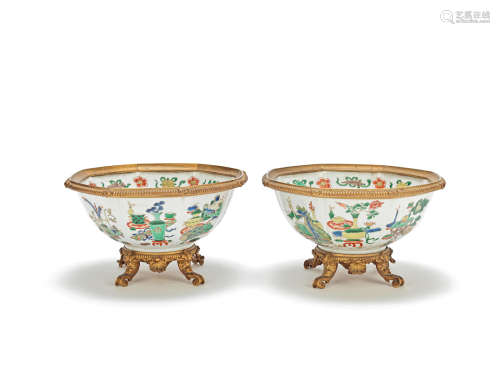 A pair of gilt-bronze mounted famille verte octagonal bowls The porcelain, Kangxi