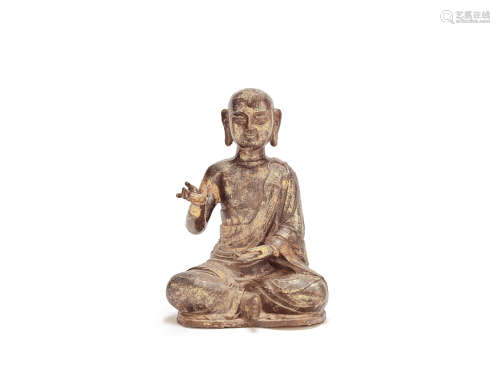 A gilt-copper alloy figure of a Monk