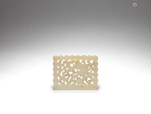 A pale green jade reticulated plaque Ming Dynasty