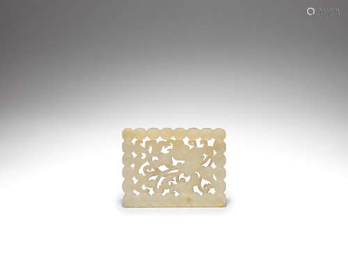 A pale green jade reticulated plaque Ming Dynasty