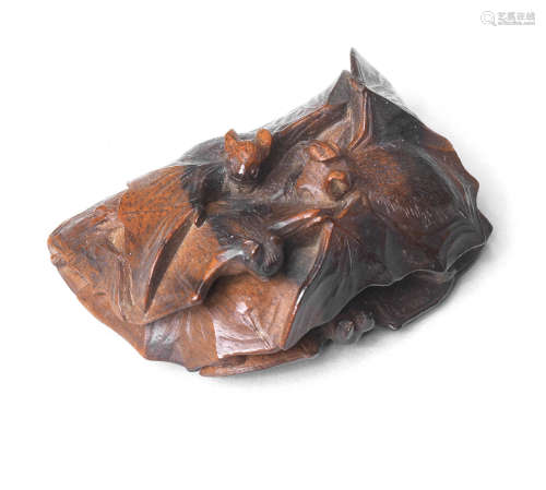 An unusual kurogaki (black persimmon) wood netsuke of bats After Kagetoshi, late 19th century
