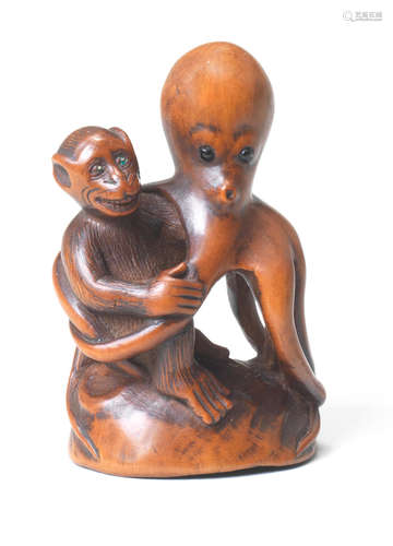 A wood netsuke of a monkey and octopus By Tanaka Minko (1735-1816), Tsu, Ise Province, late 18th/early 19th century