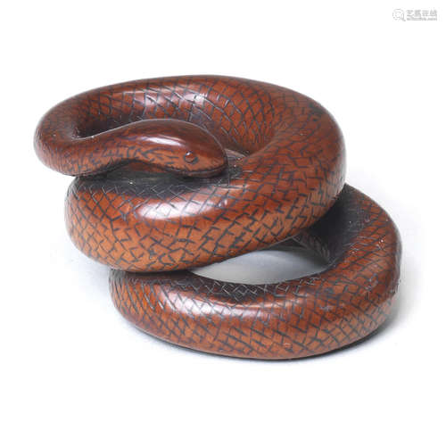 A boxwood netsuke of a coiled snake By Kashu, late 18th/early 19th century