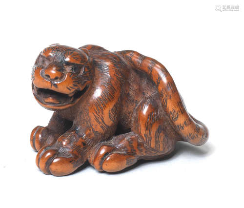 A wood netsuke of a tiger By Kokei, Kuwana, Ise Province, late 18th century