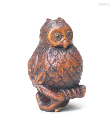 A wood netsuke of an owl Second half of the 19th century
