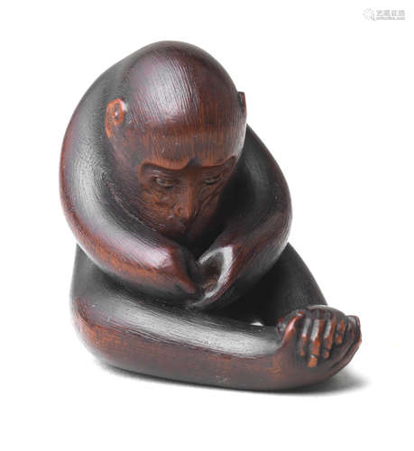 A wood netsuke of a monkey By Ikkan (1817-1893), Nagoya, mid-19th century