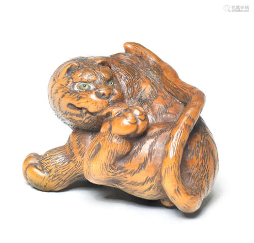 A wood netsuke of a tiger By Kokei, Kuwana, Ise Province, early 19th century