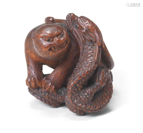 A wood netsuke of a tiger and dragon By Masatsugu, late 19th century