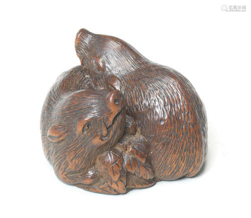 A wood netsuke of two wild boars By Tametaka, Nagoya, 18th century