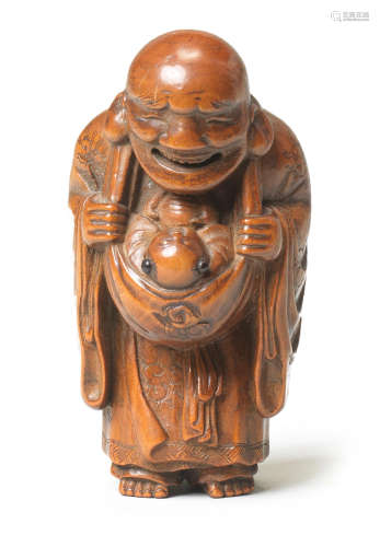 A wood netsuke of Hotei and a karako (Chinese boy) By Masatsugu, early 19th century