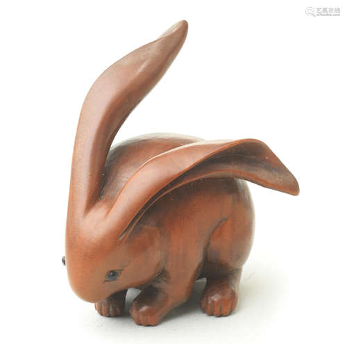 A wood netsuke of a long-eared rabbit Attributed to Ranko, 19th century