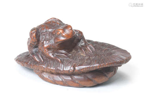 A wood netsuke of a toad on a sandal Style of Kokei, Kuwana, Ise Province, mid-19th century