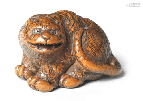 A wood netsuke of a tiger By Minsai, Tsu, Ise Province, early 19th century