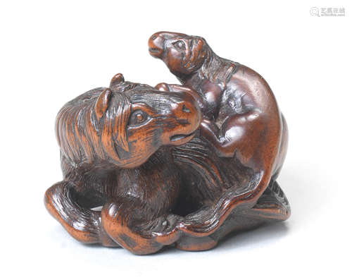 A wood netsuke of a recumbent horse with young By Kokei, Kuwana, Ise Province, early 19th century