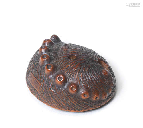 A boxwood netsuke of an awabi (abalone) By Tadayuki, Nagoya, mid-19th century