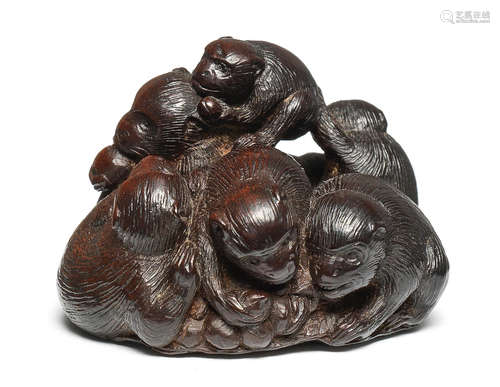 A wood netsuke of a group of monkeys By Tametaka, Nagoya, 18th century