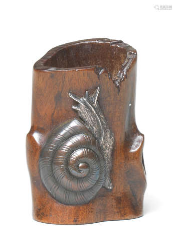 A wood netsuke of a branch with an applied metal snail By a member of the Tsuchiya Yasuchika lineage, early 19th century