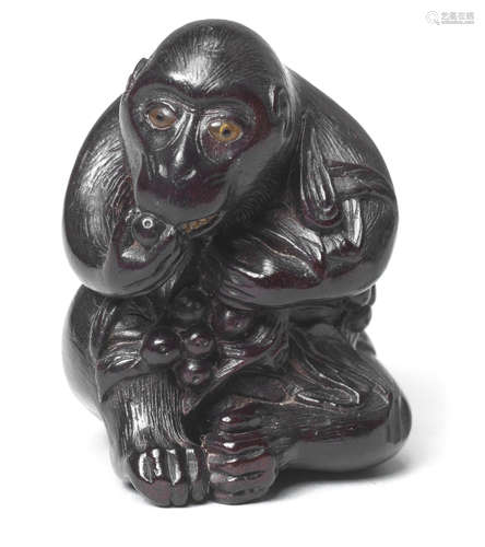 A wood netsuke of a monkey School of Kano Tomokazu, Gifu, 19th century