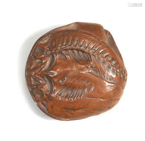 A boxwood netsuke of desiccated fish By Naomasa, mid-19th century