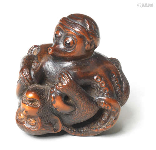 A wood netsuke of an octopus and monkey Early/mid-19th century