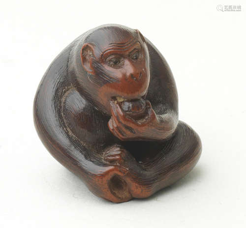 A wood netsuke of a monkey By Tanaka Minko (1735-1816), Tsu, Ise Province, late 18th/early 19th century