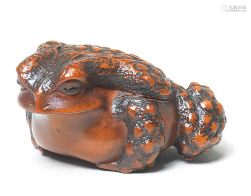 A boxwood netsuke of a toad By Masanao, Yamada, Ise Province, 19th century