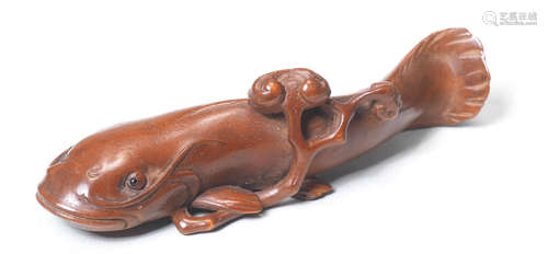 A boxwood netsuke of a namazu (catfish) Late 19th century