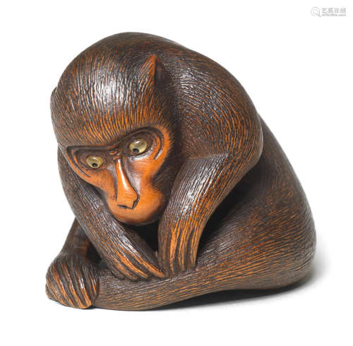 A boxwood netsuke of a monkey By Koichi, late 19th century