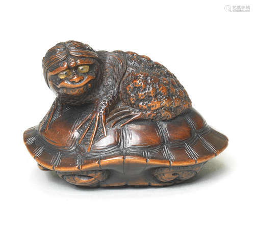 A wood netsuke of a kappa on a tortoise By Naito Toyomasa (1773-1856), Tanba Province, early 19th century