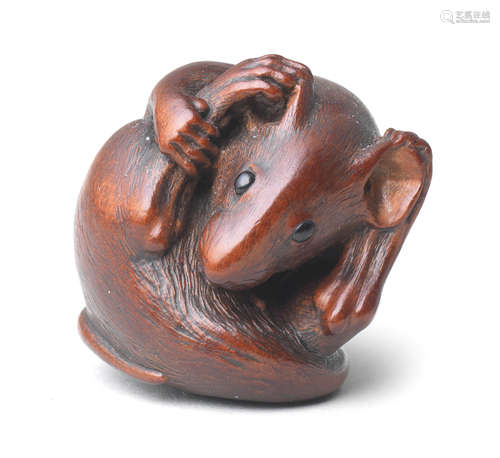 A wood netsuke of a coiled rat By Nobuyoshi, mid-late 19th century