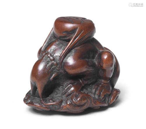 A wood netsuke of Raijin By Ittan, Nagoya, mid-19th century