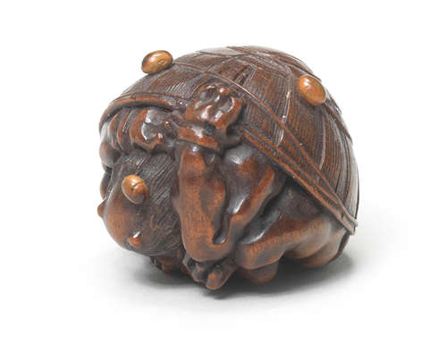 A wood netsuke of an oni By Masakazu, Nagoya, 19th century