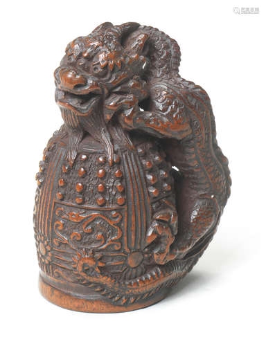 A wood netsuke of Kiyohime on the Dojoji bell By Tametaka, Nagoya, late 18th century