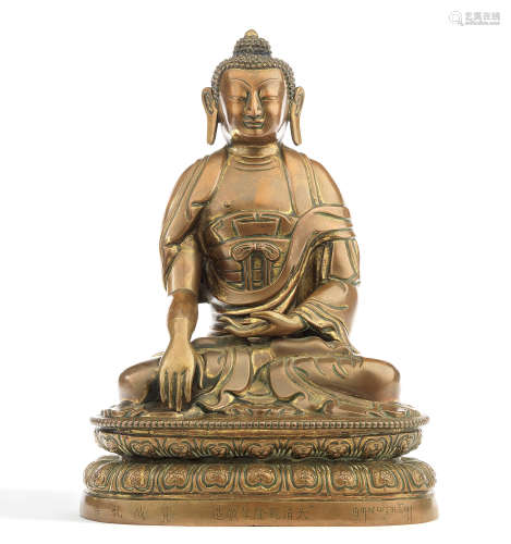 A large copper-alloy repoussé figure of Buddha Qianlong seven-character mark and of the period