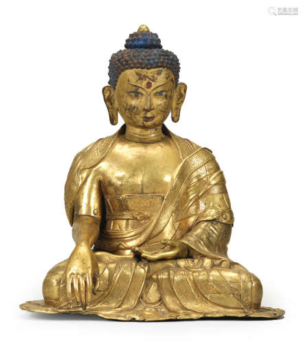 A large gilt copper-alloy repoussé figure of Buddha Shakyamuni Tibet, 17th century