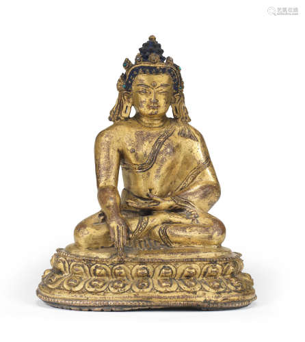 A gilt-bronze figure of Akshobhya Tibet, 15th century