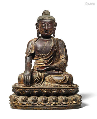 A large gilt-lacquered bronze figure of Buddha Shakyamuni Mid Ming Dynasty