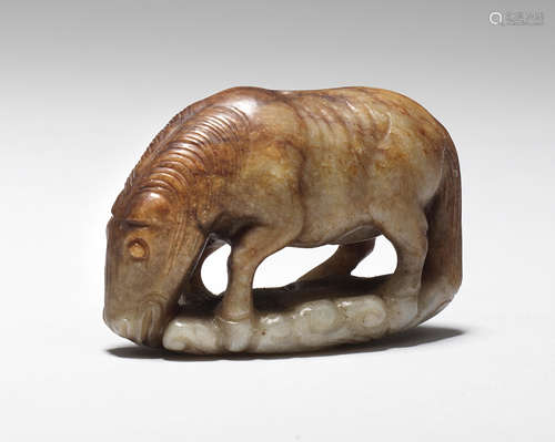 A pale green and russet jade carving of a horse Ming Dynasty