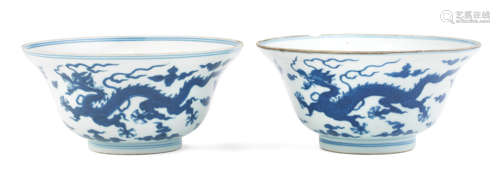 A near pair of blue and white 'dragon' bowls Qianlong seal marks and of the period